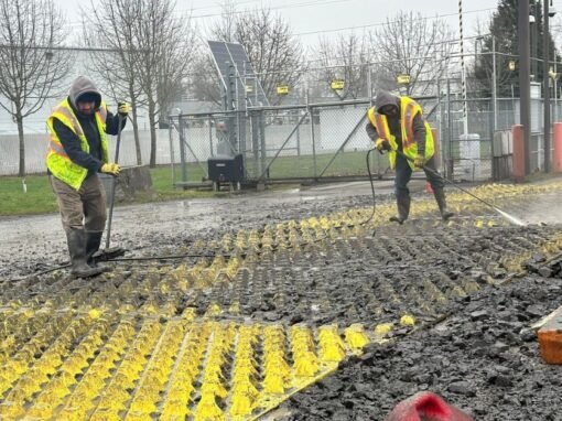 Pressure washing trackout control mats at a construction site in Salem OR