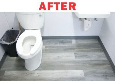 Gray vinyl flooring installed in commercial bathroom in Portland – After renovation by Frank Handyman Services