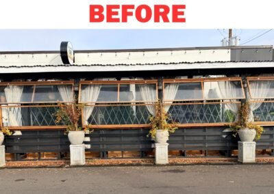 Exterior commercial patio enclosure with damaged and worn wooden panels, ready for professional restoration by Frank Handyman Service.